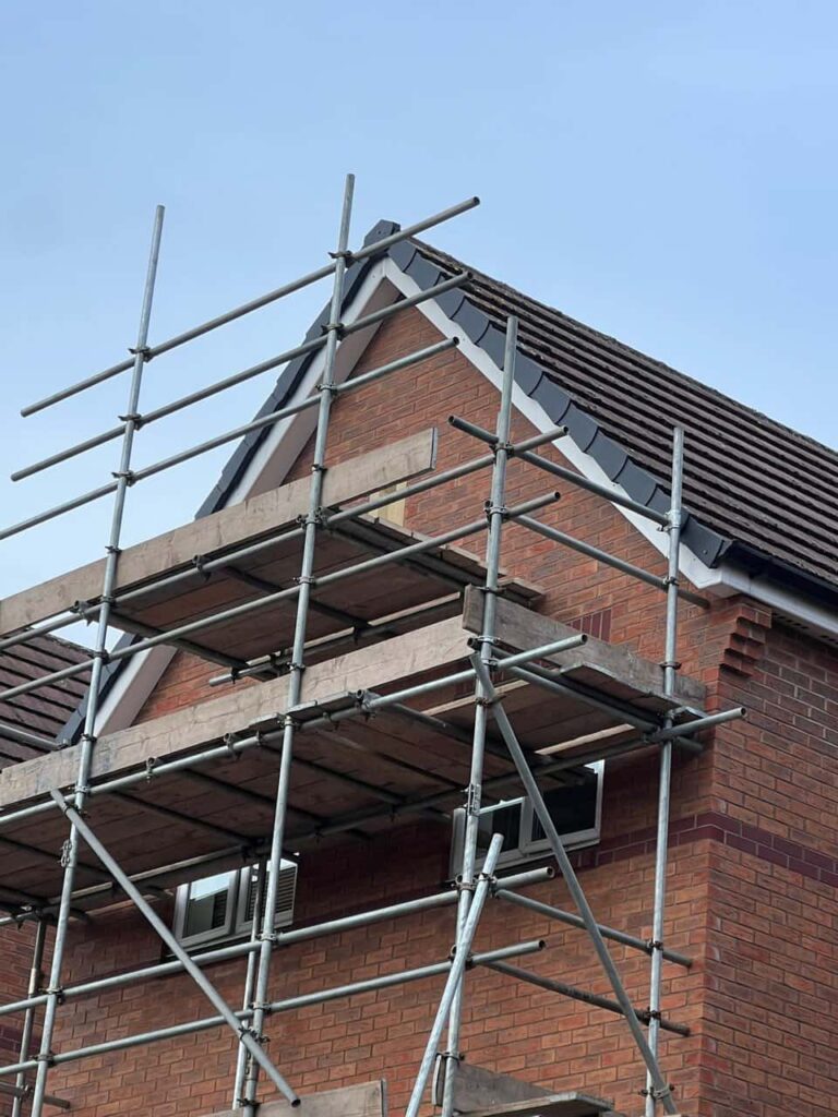 This is a photo of a roof which has just been repaired. There is a scaffold located at the gable end for access onto the roof. Works carried out by Stowmarket Roofing Repairs